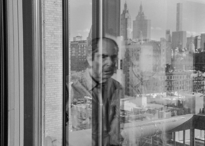 RETRANSMISSION TO DELETE REFERENCE TO STORY AND OFFER AS STAND-ALONE PHOTO -- Seen in reflection, the author Philip Roth, at home in Manhattan?s Upper West Side, Jan. 5, 2018. Roth stopped writing about seven years ago, and now reads, mainly American history and modern European history. ?Reading has taken the place of writing, and constitutes the major part, the stimulus, of my thinking life,? Roth said. (Philip Montgomery/The New York Times)