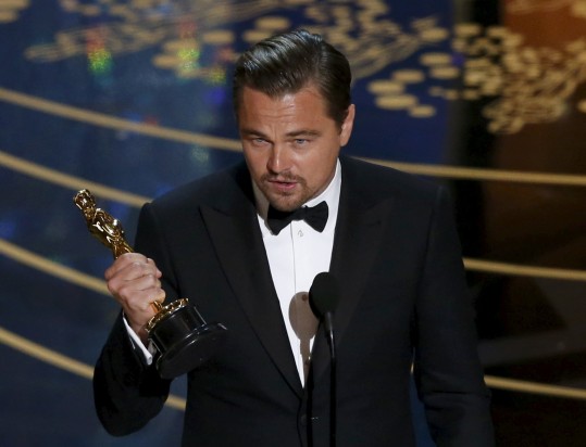 Leonardo DiCaprio accepts the Oscar for Best Actor for the movie 