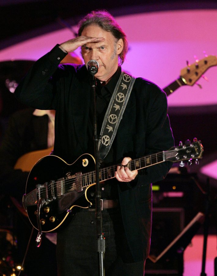 Singer Neil Young performs a 